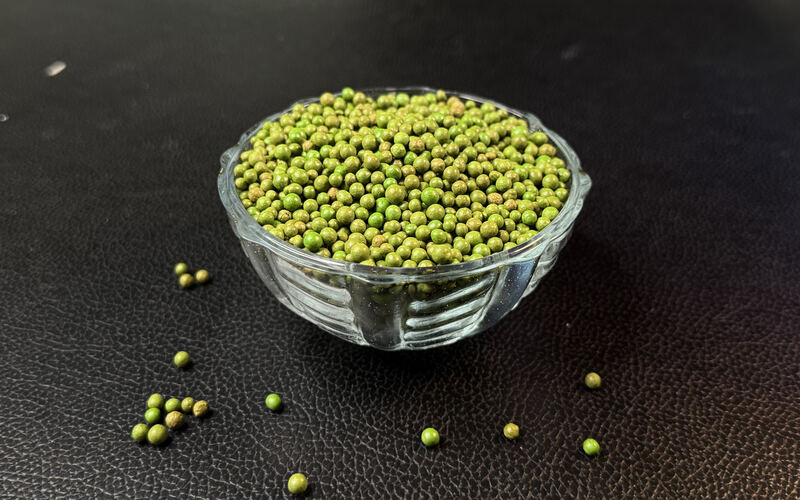 Green bentonite granules in a glass bowl